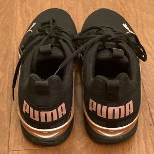Puma Axelion metallic with rose Gold accents. Size 11 worn once.